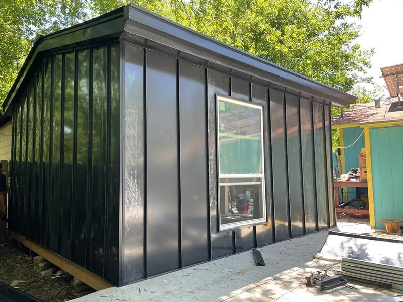 Black standing seam metal wall panels for Roof Inspection in Highland Village