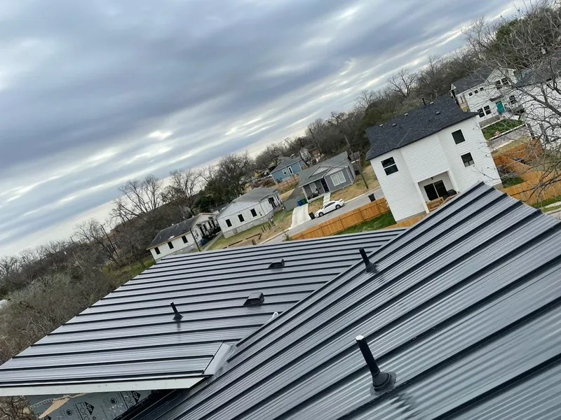 Standing seam metal roof panels with vents for Skylight Repair in Highland Village